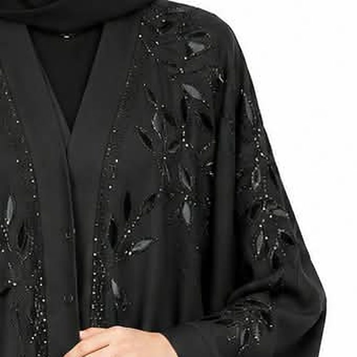 Leaf appliqué and beading on the shoulder