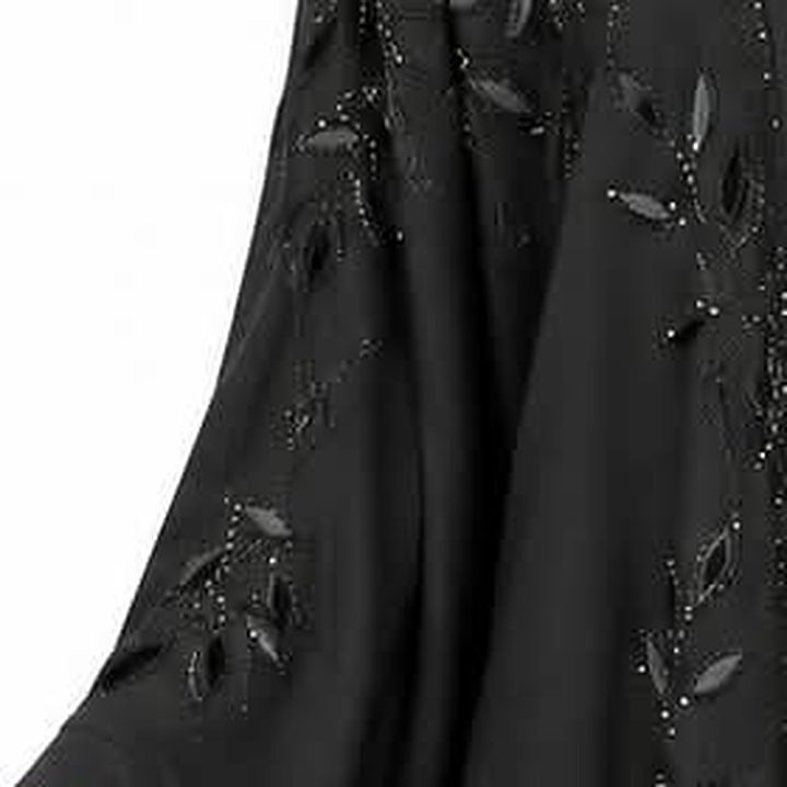 Appliqué leaves along the sleeve